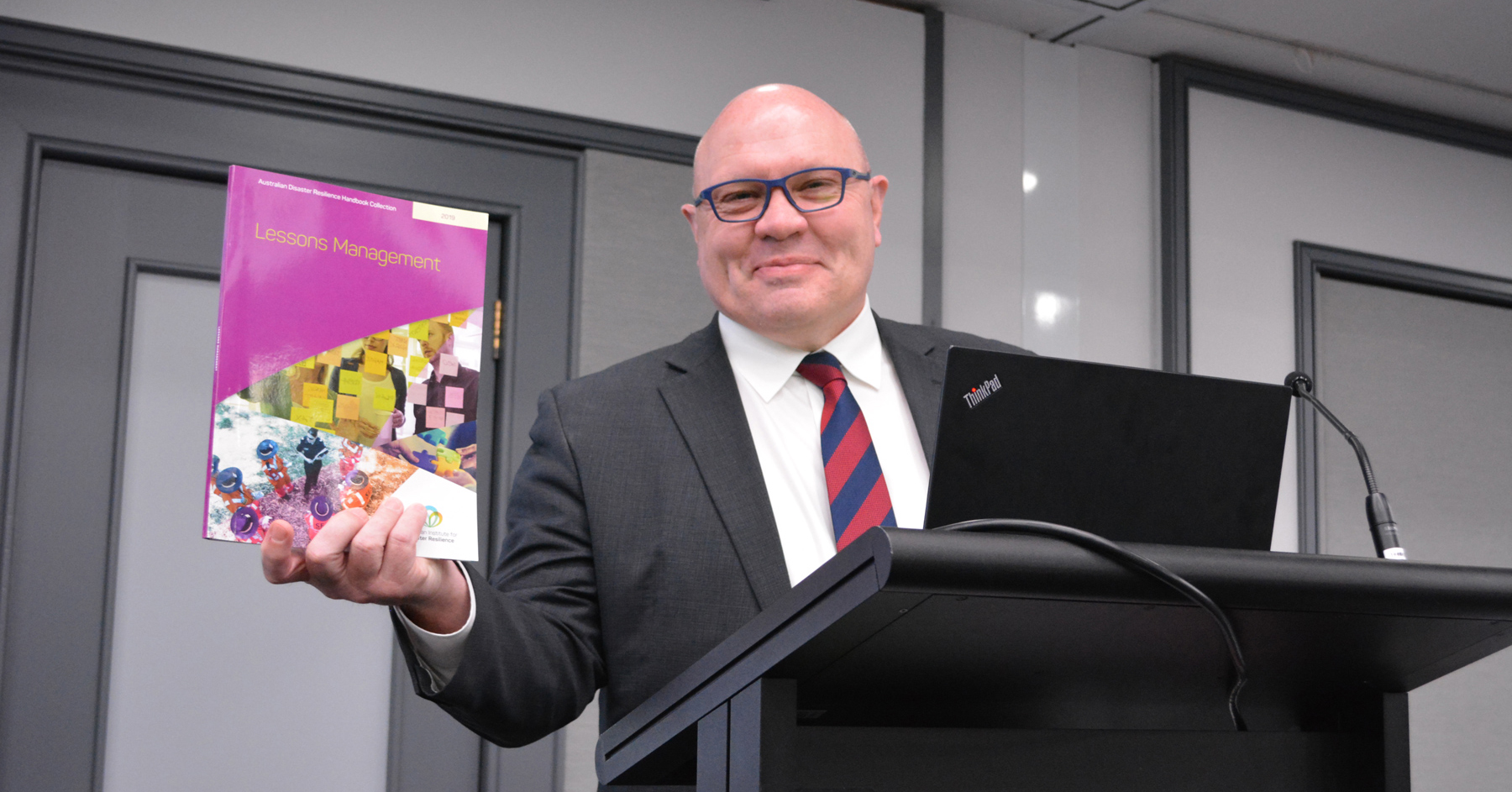 Emergency Management Australian Director-General Rob Cameron launches the Lessons Management Handbook at the Forum.