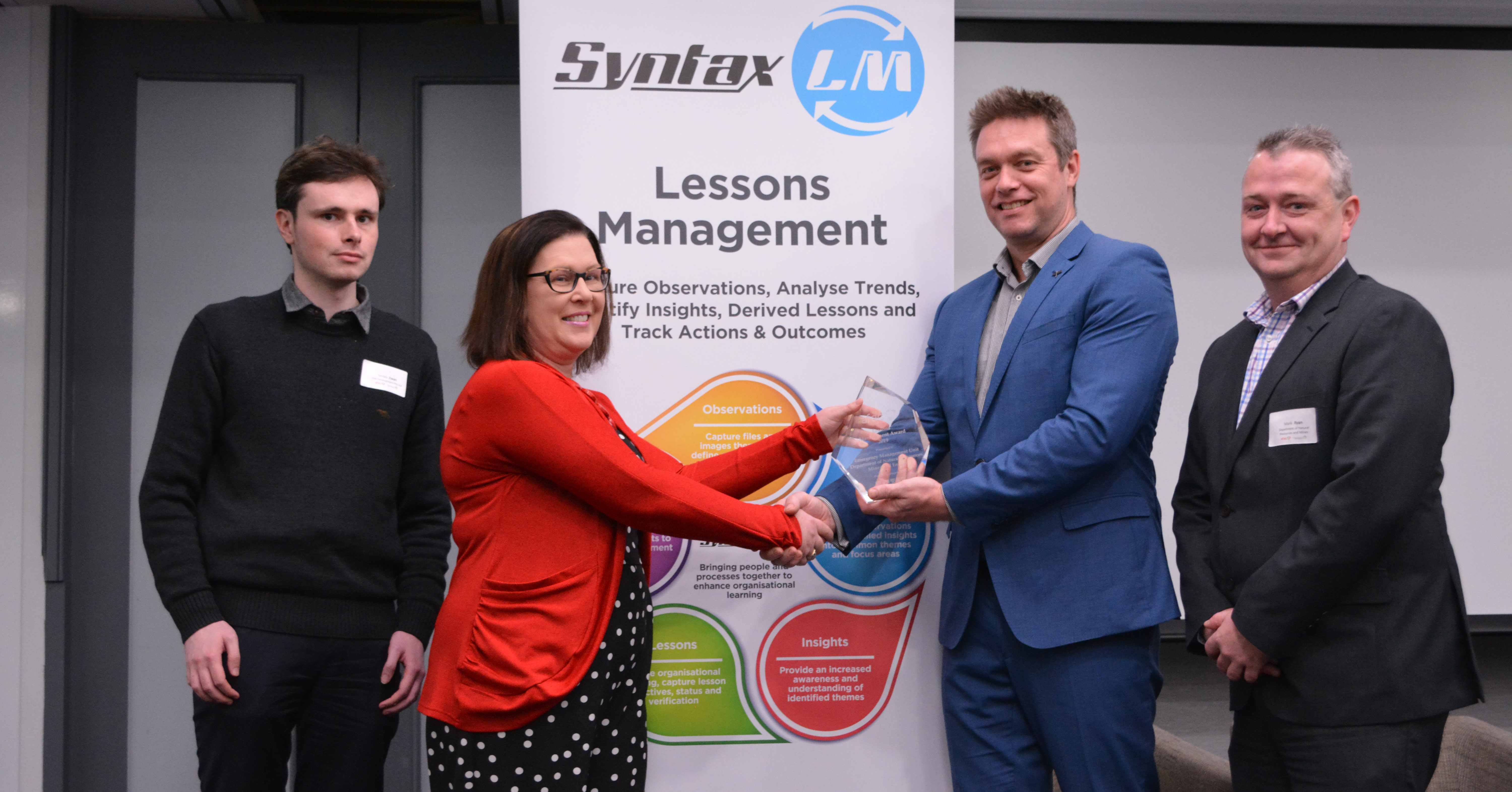 From L to R: James Ewan, Software Engineer, ISW Development; Louise Mills, Service Delivery Manager, ISW Development; and the winners of the 2019 Lessons Management Award, Mark Prime and Mark Ryan from the Emergency Management Unit, Queensland Department of Natural Resources, Mines and Energy.